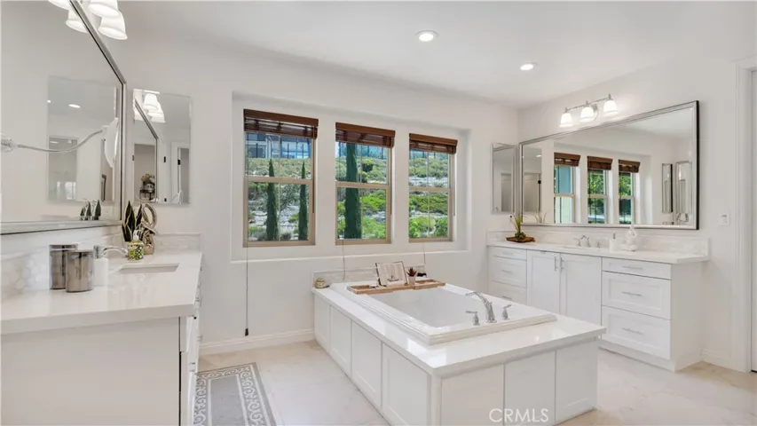Beautiful primary bathroom with a spacious, well-appointed design