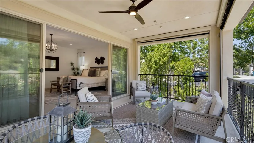 Covered outdoor living space extending the primary suite outdoors