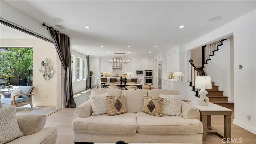Living area with an open view toward the staircase and adjoining spaces