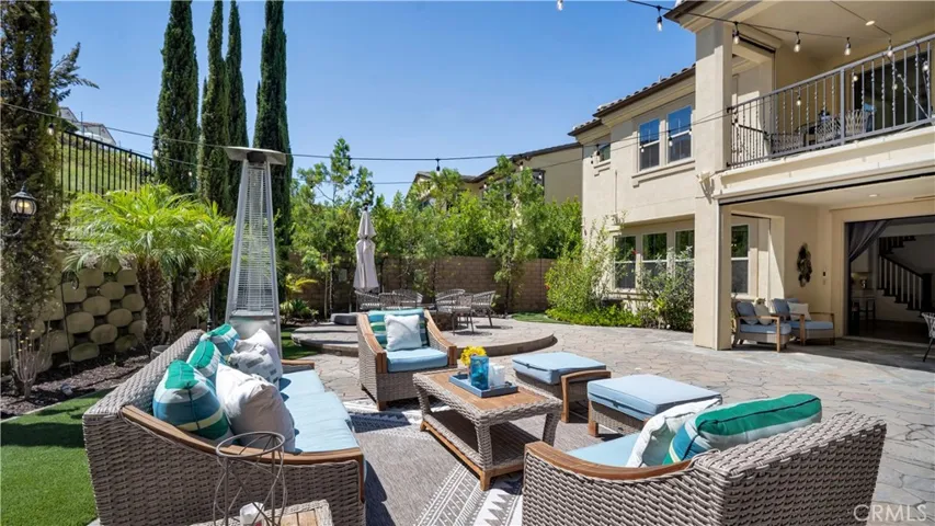 Spacious backyard offering multiple areas for outdoor enjoyment