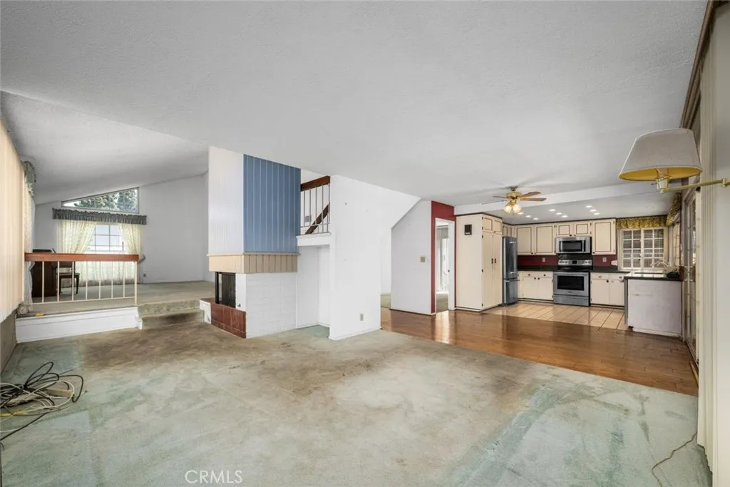 Gas fireplace sits in the corner.