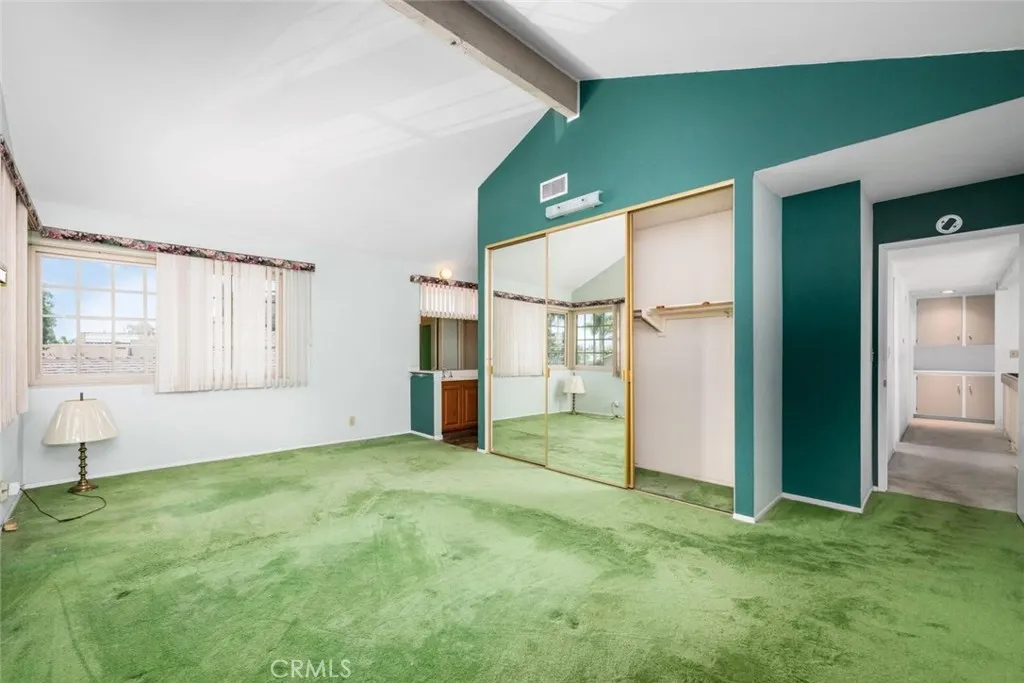 Wide 3-door mirrored closet doors.