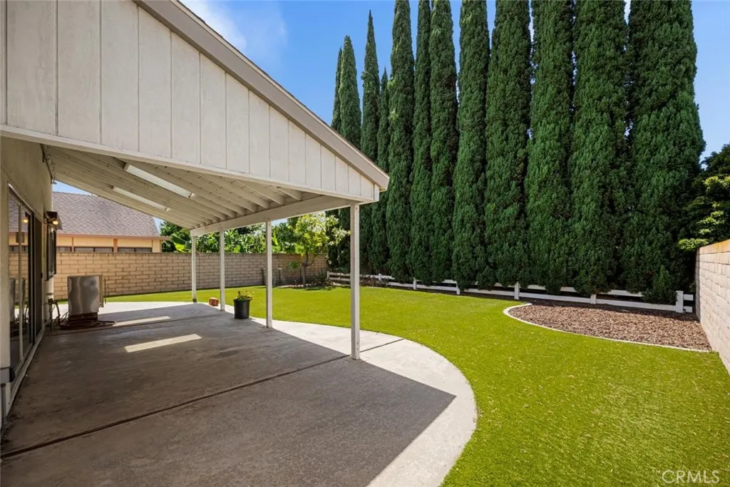 Covered patio has skylights to bring in the sunshine.