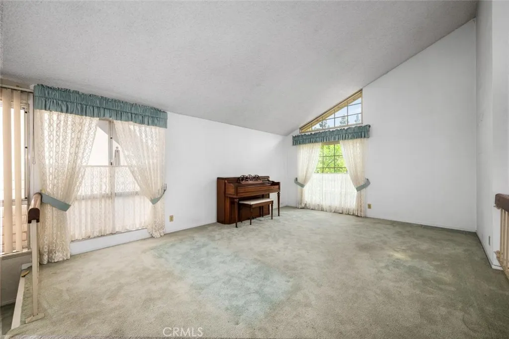 Vision a room with laminate flooring and freshly painted walls.