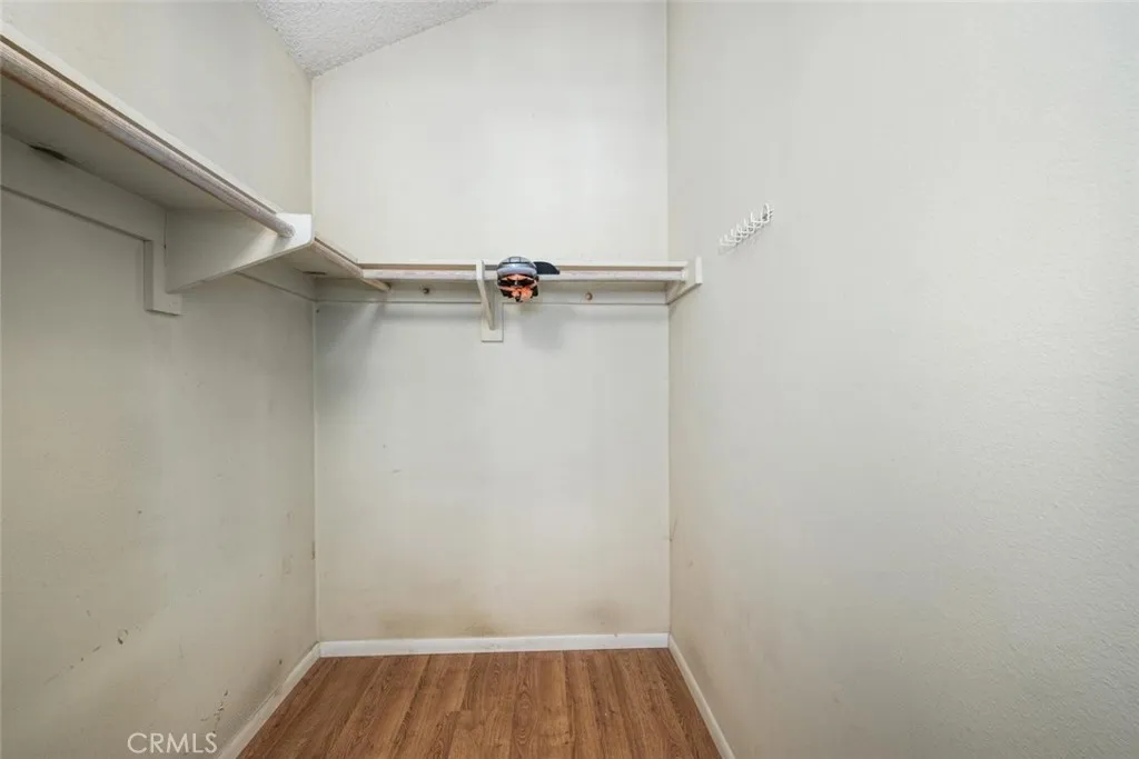 Primary bedroom walk-in closet.