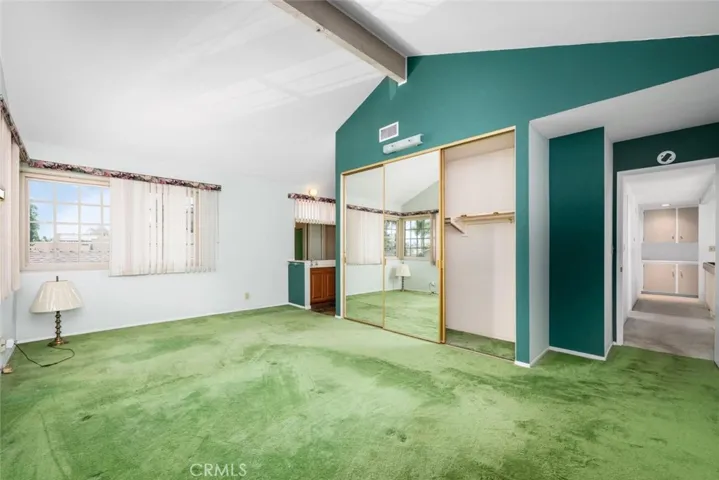 Wide 3-door mirrored closet doors.