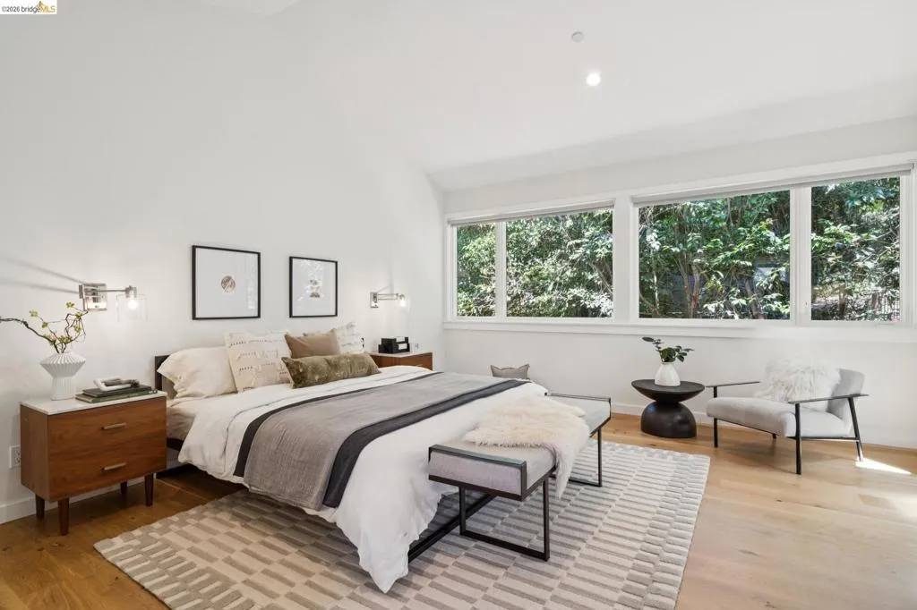 Hardwood flooring, recessed lighting, and wall-mounted sconces Hardwood flooring, recessed lighting, and wall-mounted sconces