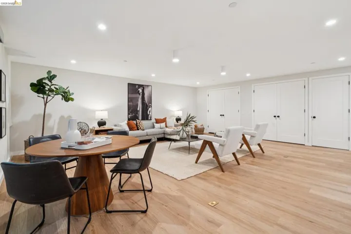 Recessed lighting, wood-finish flooring, and multiple built-in storage closets