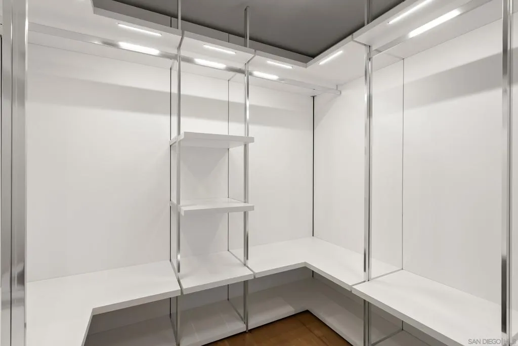 Primary bedroom walk in closet