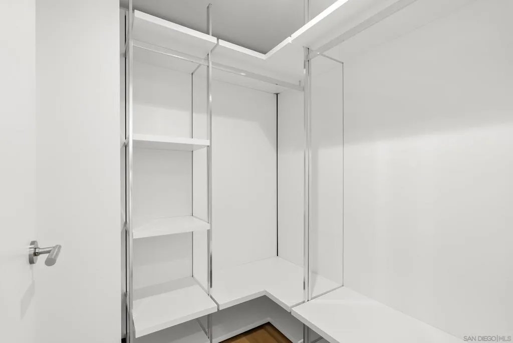 Guest bedroom/office includes a spacious walk in closet.