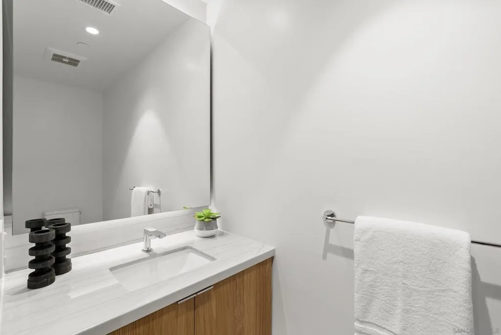 4th bathroom, located near entry convenient for guests.