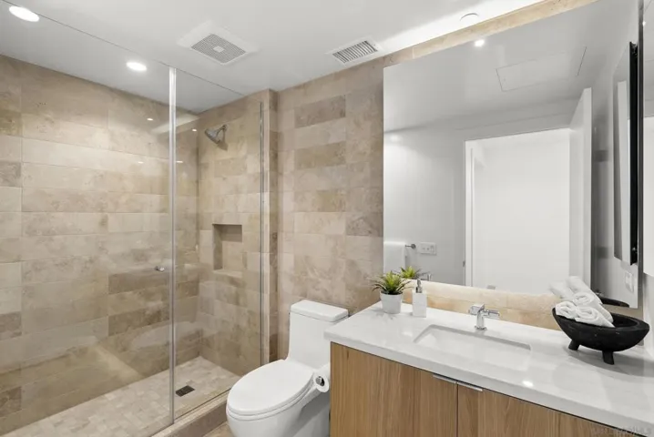 Guest bedroom offers a spacious en suite bathroom.
