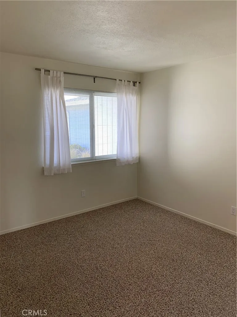 Second bedroom with front window towards entrance
