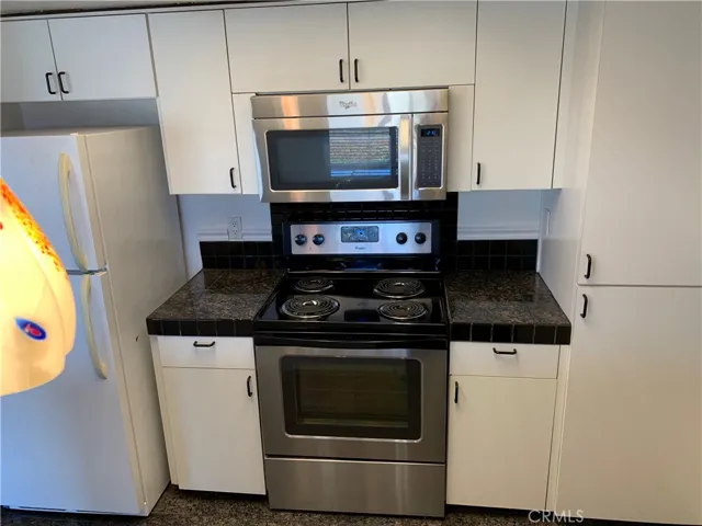 Electric stove, microwave and Fridge