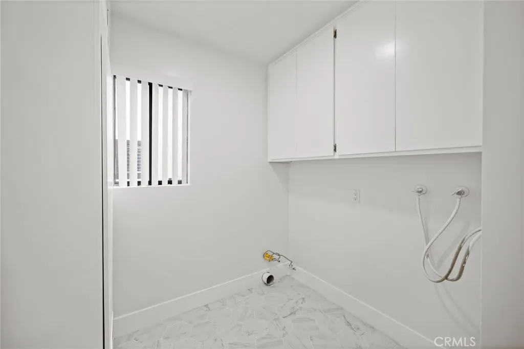 Upstairs laundry with lots of storage