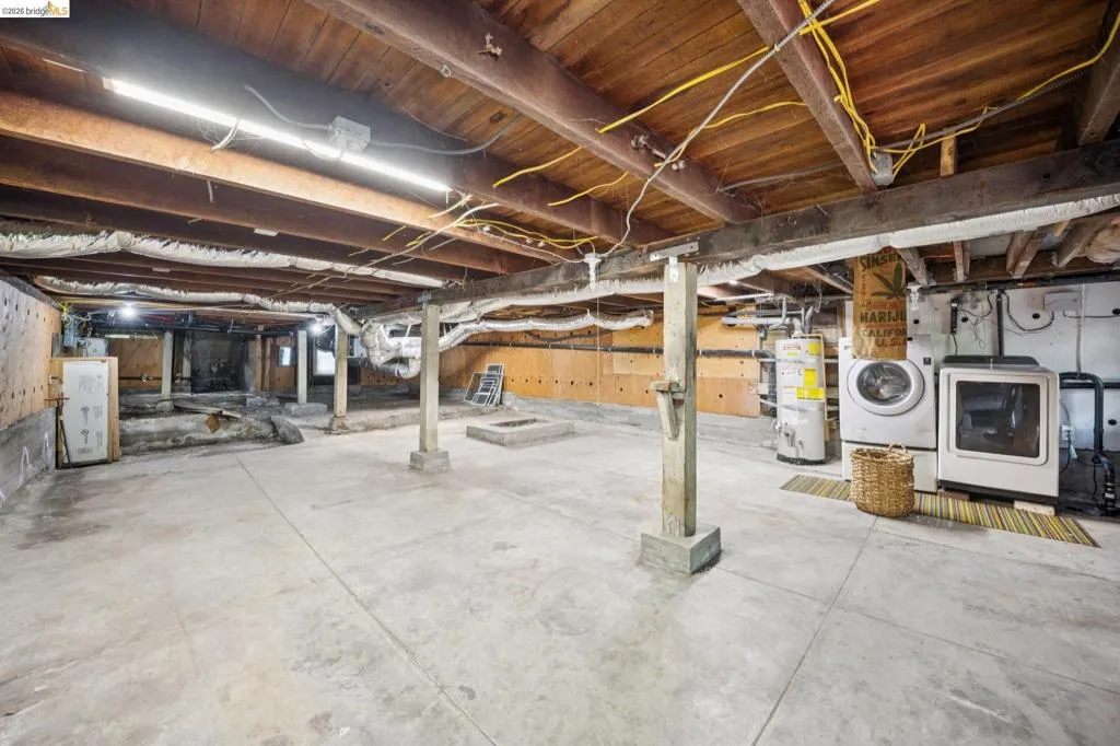 Concrete flooring with exposed wood joists and support beams