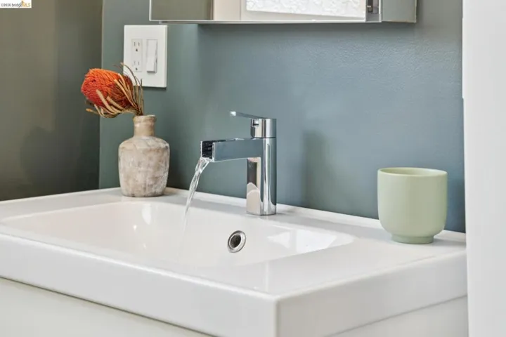 Rectangular undermount sink with a single-handle chrome faucet