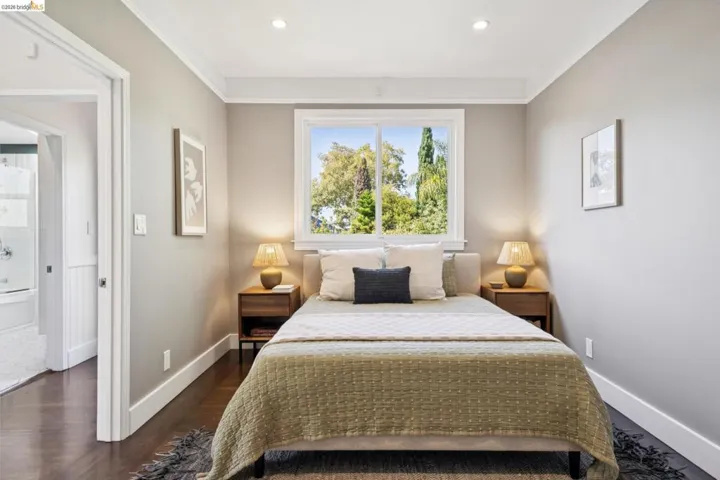Hardwood flooring, recessed lighting, and crown molding