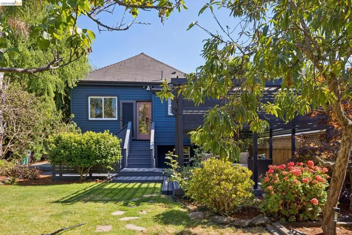 Blue exterior siding with white window trim