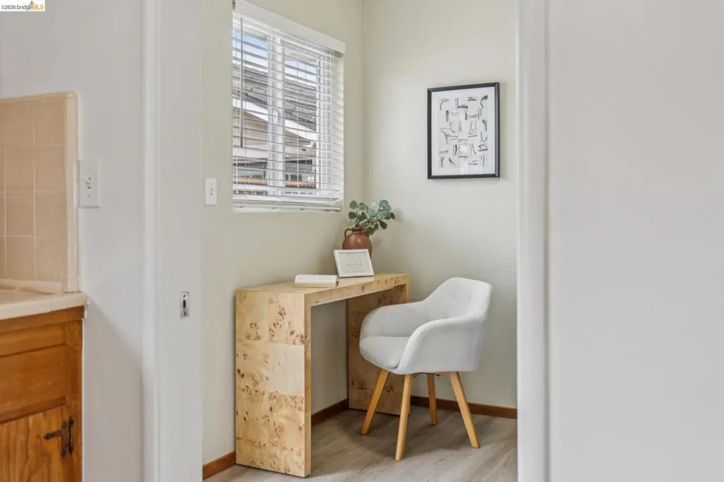 Built-in desk featuring a light wood-finish surface