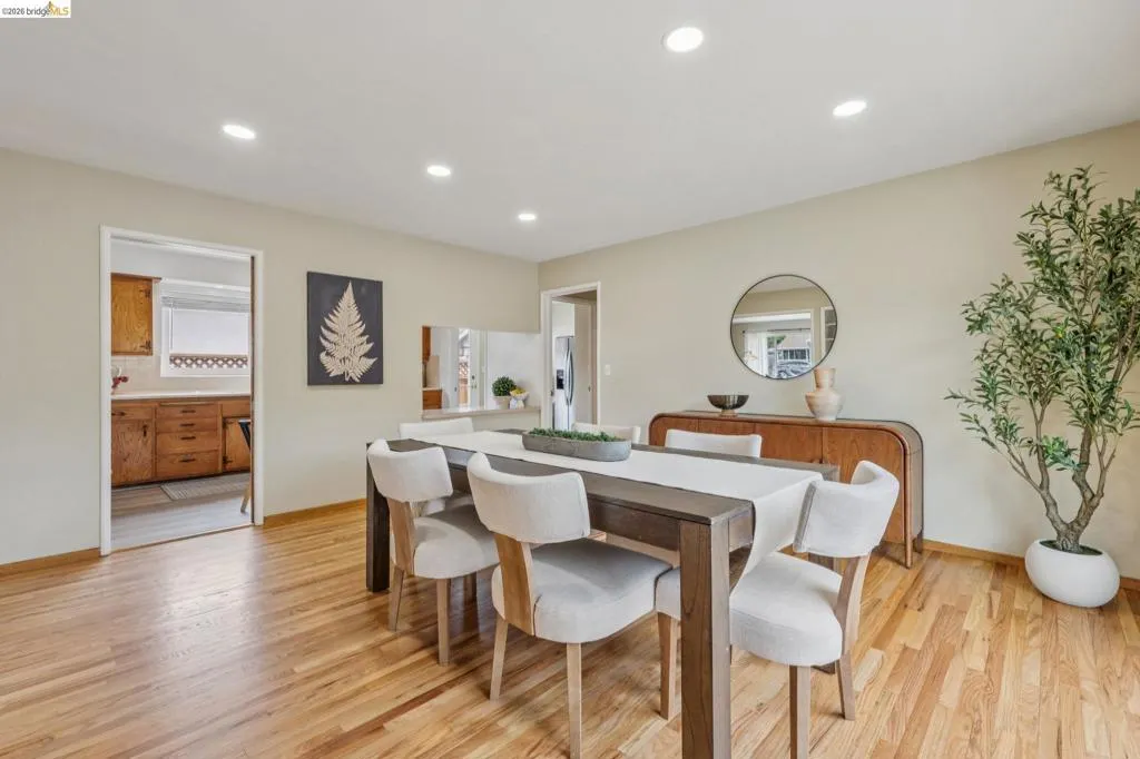 Hardwood flooring throughout, recessed lighting, and neutral wall tones