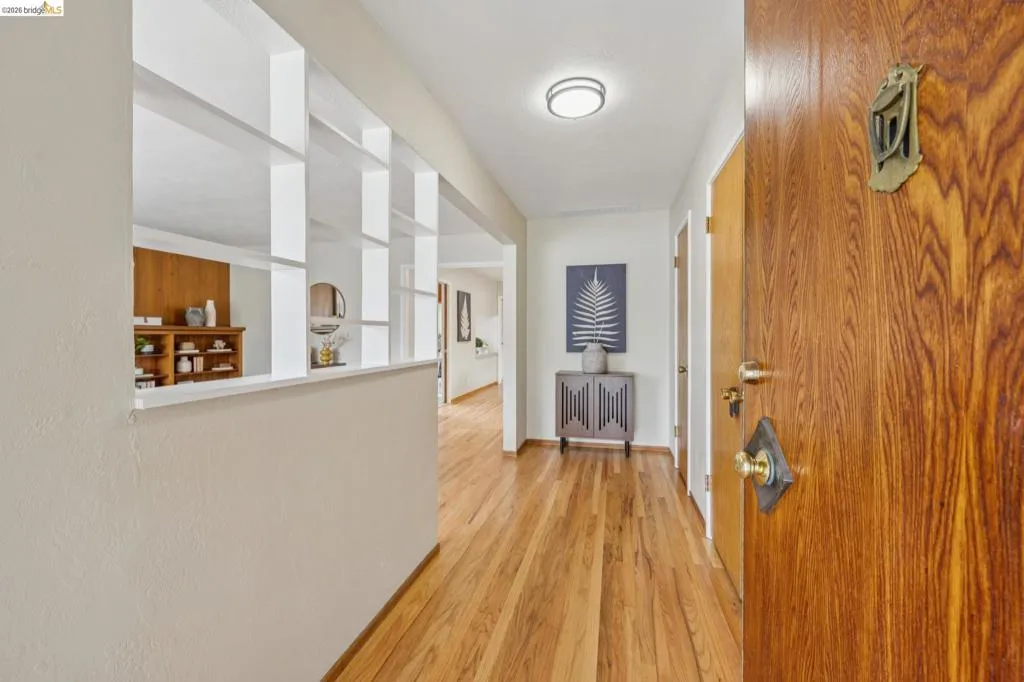 Wood-finish entry door with brass hardware