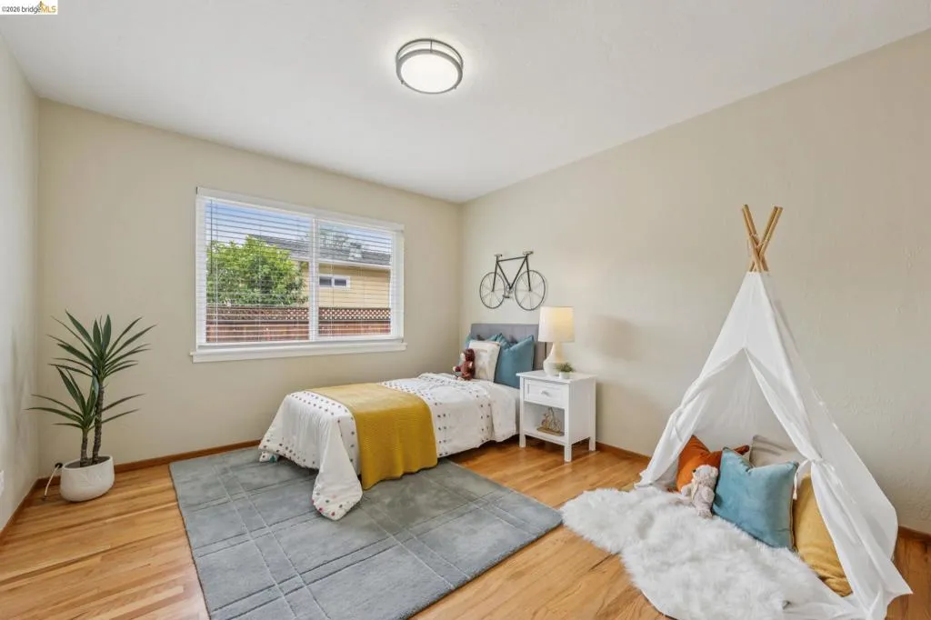 Hardwood flooring and light-toned walls create a bright interior