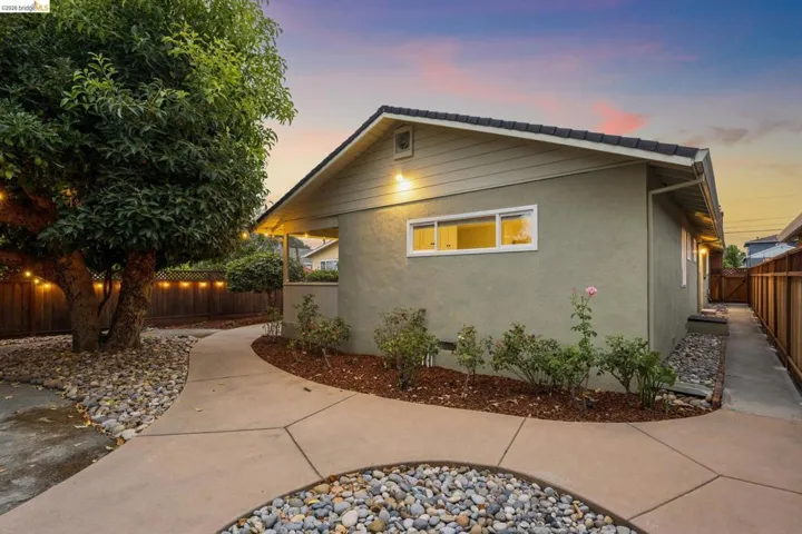 Stucco exterior with a tiled roof