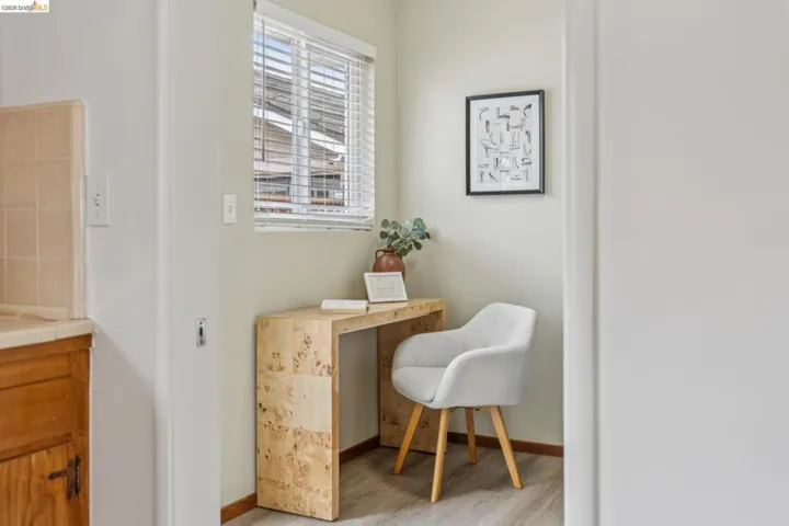 Built-in desk featuring a light wood-finish surface