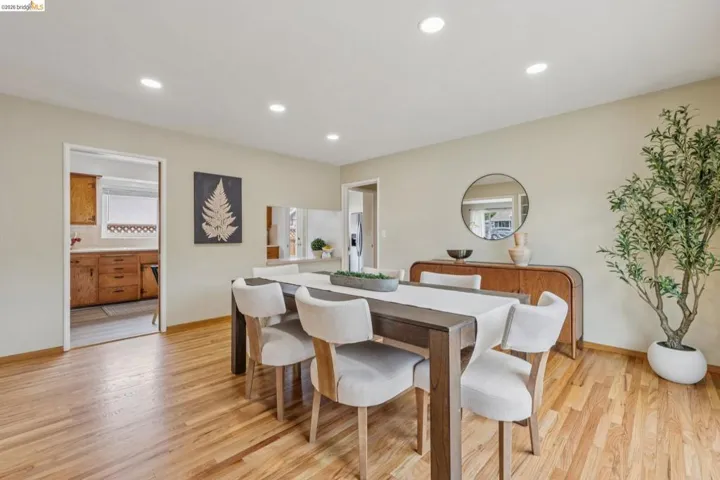 Hardwood flooring throughout, recessed lighting, and neutral wall tones