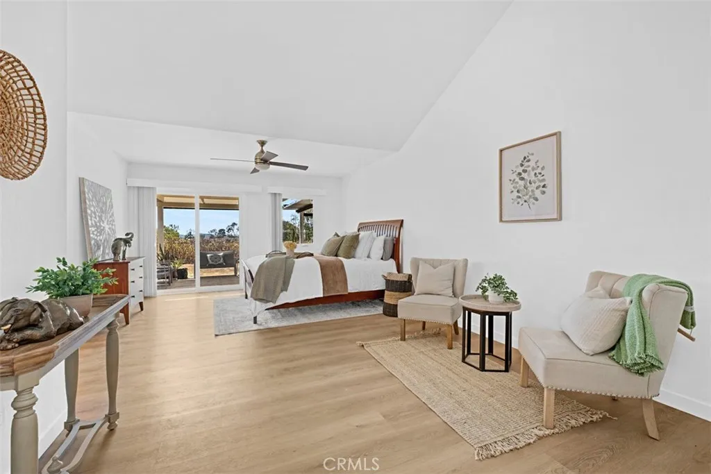 Primary retreat with views and door to its own patio sitting area