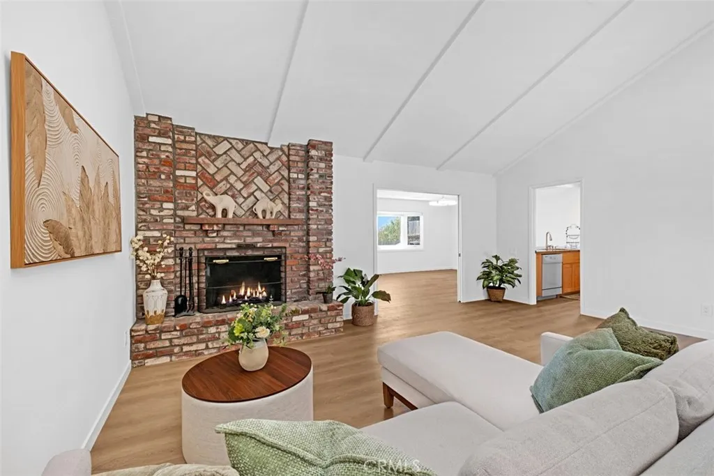 Enter into your living room with high ceilings and fireplace