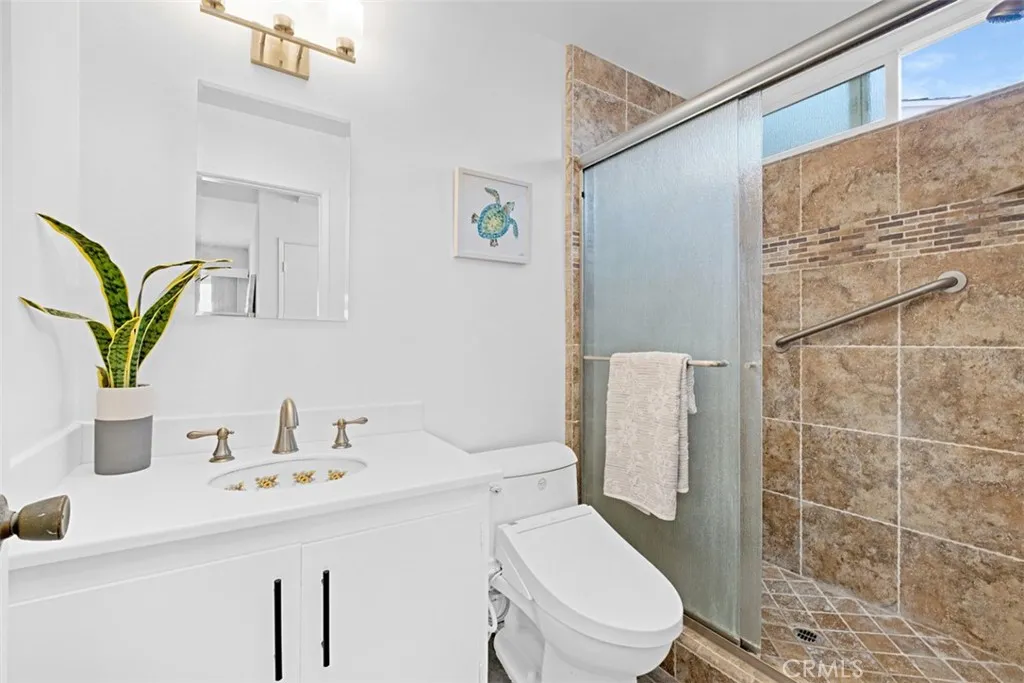 Primary bath with step in stone shower,