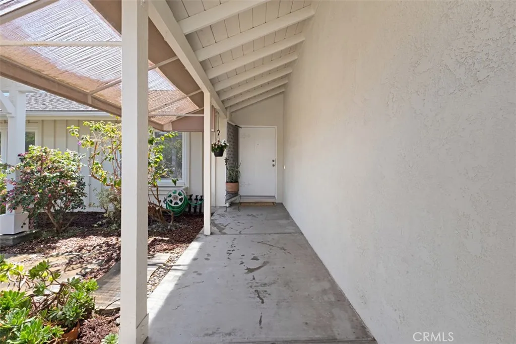 Enter through your gate to the to the beautiful front yard space