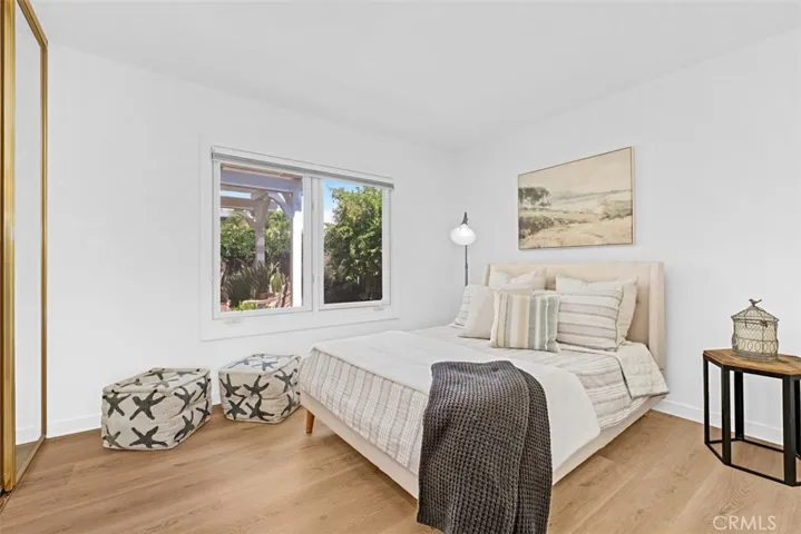 Secondary bedroom with window to courtyard, Mirror wardrobe