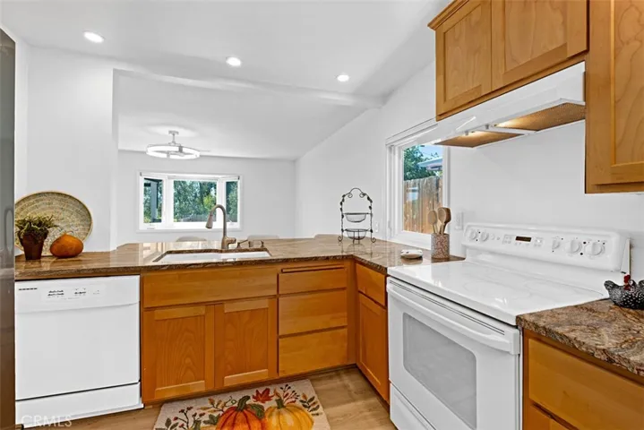 Kitchen opens up to large bonus room