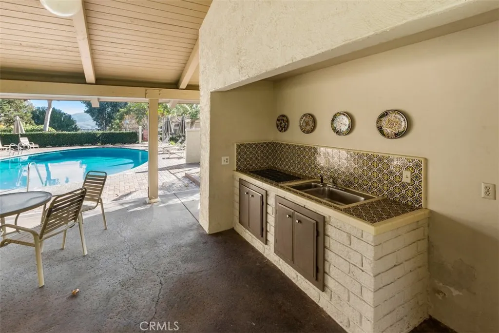 Covered Clubhouse area by the pool for gatherings.