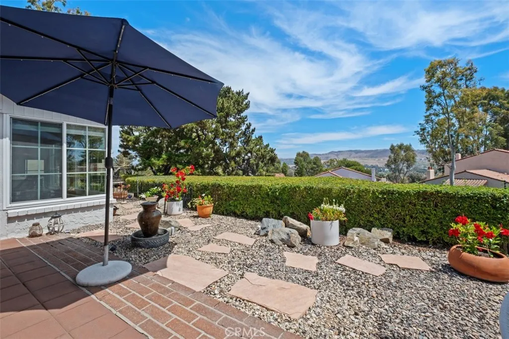 Lovely back patio area with a tranquil water feature and vast views.
