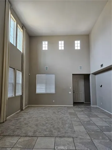 Dining area & living room with very high ceilings
