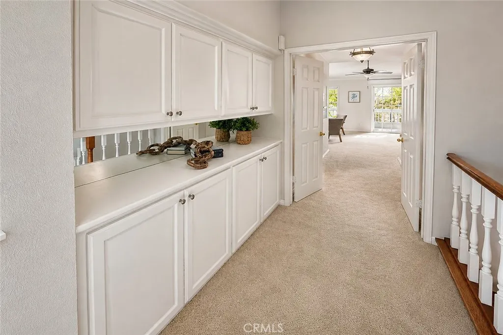 Central Hall between bedrooms has another built-in storage area right at the top of the stairs.