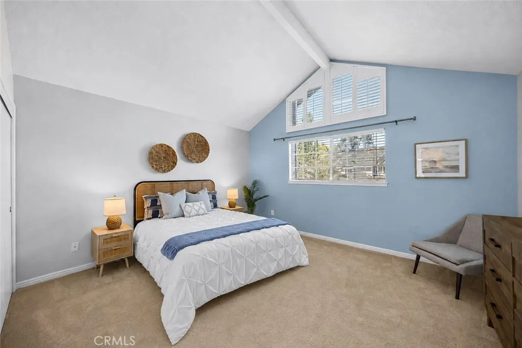 Large 2nd Bedroom has vaulted ceilings and plantation shutters