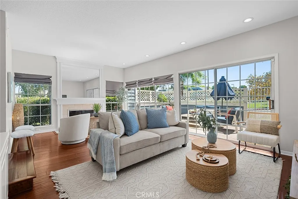 Huge Living room with a wall of windows that over looks your oversized patio. Tons of natural light floods the space.