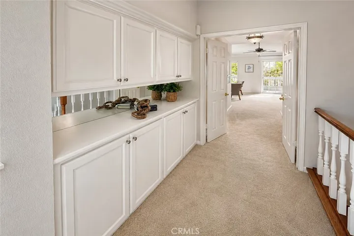 Central Hall between bedrooms has another built-in storage area right at the top of the stairs.