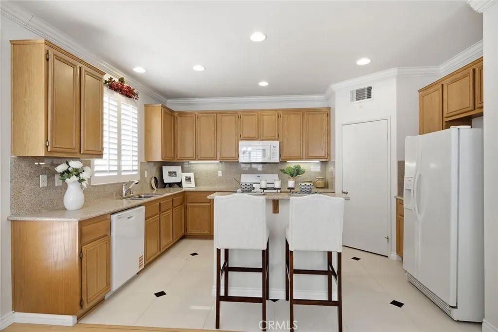 Spacious kitchen area with plenty of cabinets and counterspace.
