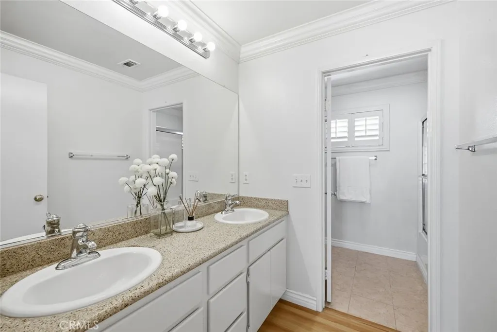 Dual sink hallway bathroom.