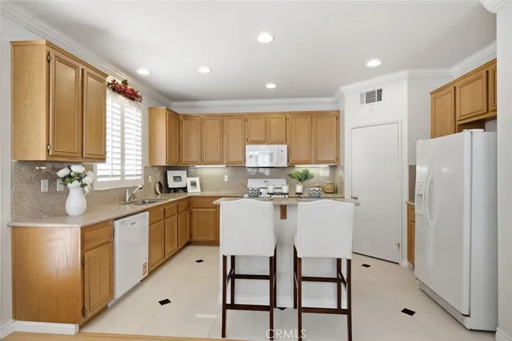Spacious kitchen area with plenty of cabinets and counterspace.