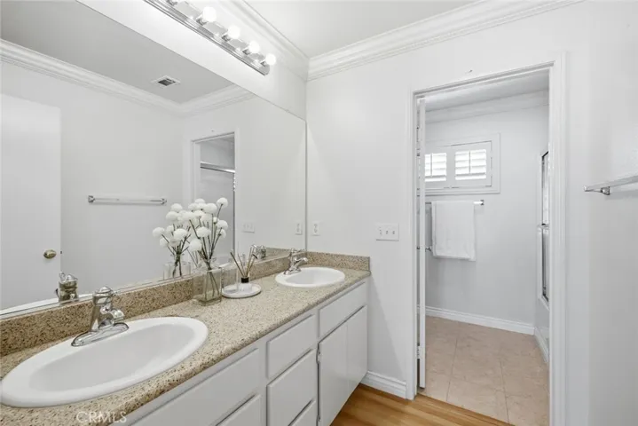 Dual sink hallway bathroom.