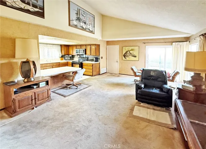 The Heart of the Home is this Amazing Family Room with Soaring Ceiling and Slider to Backyard