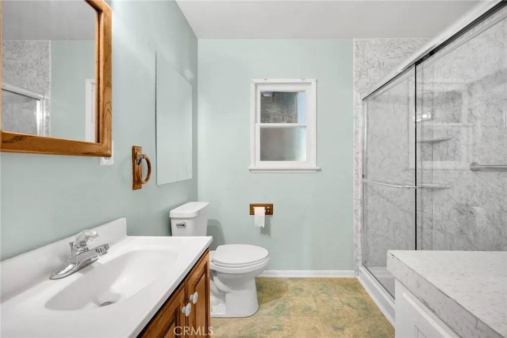 Bathroom with walk-in shower.
