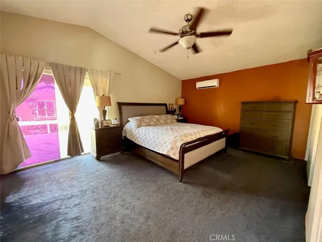 Primary Bedroom with sliding door to balcony